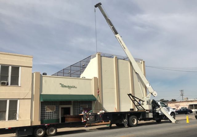 Crane in front of restaurant