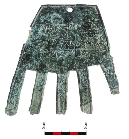 metallic hand with inscription