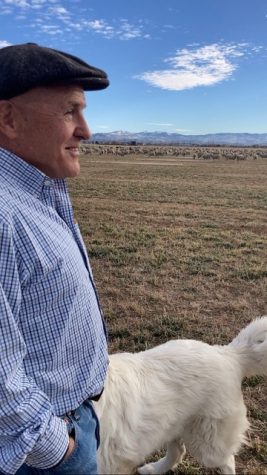 Nevada sheep rancher Ted Borda wearing a beret next to a dog