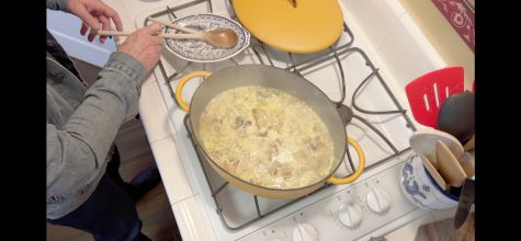 A pan with sauteed garlic on the stove