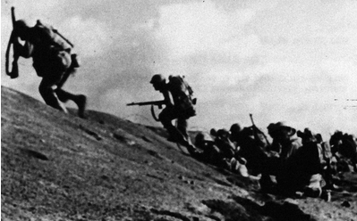 Americans charge during the battle of Iwo Jima in World War II. Courtesy of the National Archives and Records Administration.