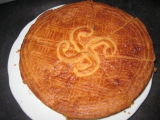 Basque cake with lauburu on top. Gateau Basque
