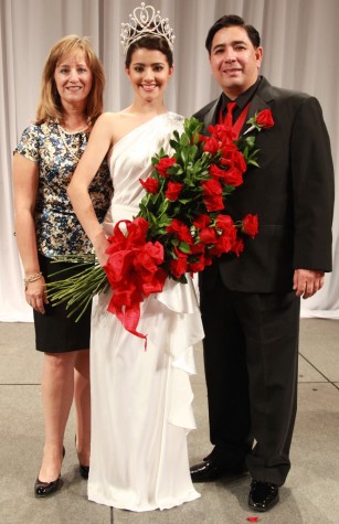 Rose Queen Vanessa Manjarrez holding a bouquet of red roses, flanked by her parents.