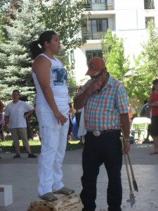 Stephanie Braña competes at the collegiate level after learning how to chop logs from her father. Here she is accompanied by her coach, Jesus Goñi