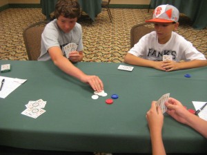 Josh Pese and Alex Goyhenetche play against each other in the junior mus tournament.