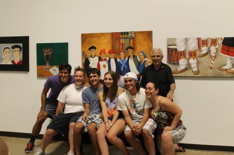 The Sangroniz grandchildren pose with artist Bob Ithurralde under the painting of them.