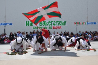 The Basque flag flies during dancing at the Bakersfield fronton.